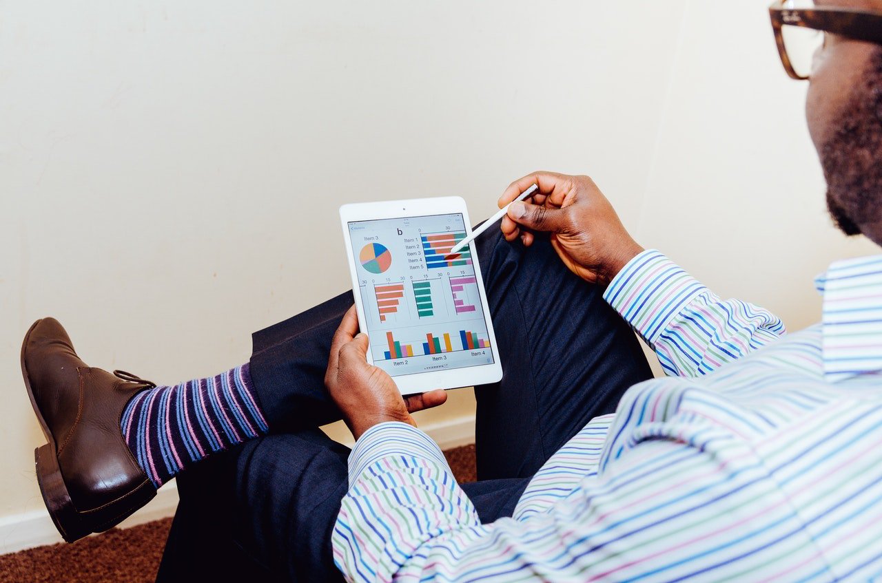Man uses membership software reporting and metrics for sales insights